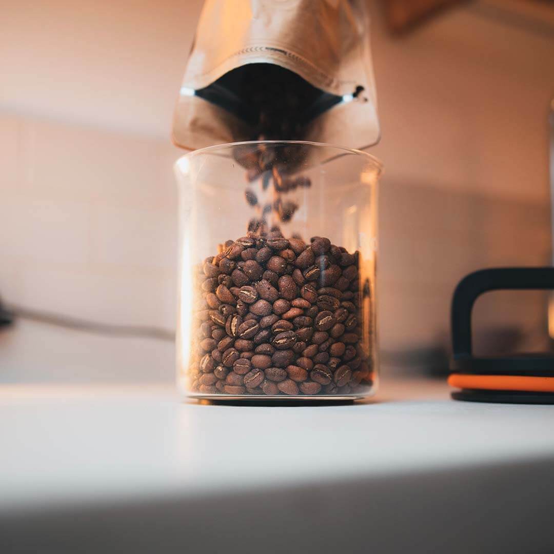 The Zero Jar without its lid, being filled up with coffee beans